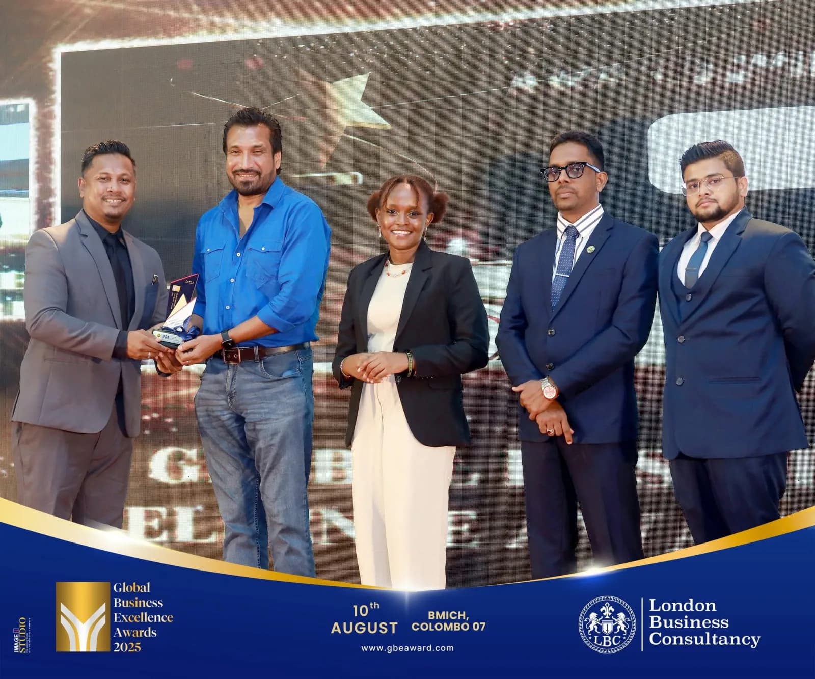 Business award presentation on a large LED stage in Colombo